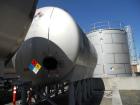 Used Cherry Burrell 10,000 Gallon Stainless Steel Horizontal Storage Tank. Approximately 10'6