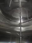 Used Cherry Burrell 8000 Gallon Vertical Stainless Steel Tank.Top mounted agitator, side manway, sightglass, 3