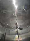 Used Cherry Burrell 8000 Gallon Vertical Stainless Steel Tank.Side mounted 5 hp agitator, side manway, sightglass, 12' diameter x 8'6