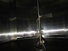 Used Cherry Burrell 8000 Gallon Vertical Stainless Steel Tank.Side mounted 5 hp agitator, side manway, sightglass, 12' diameter x 8'6