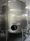 Used Cherry Burrell 8000 Gallon Vertical Stainless Steel Tank.5 Hp side mounted agitator, dual impeller, bearing block, side manway, sightglass, 12' diameter x 8'6