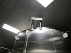 Used Cherry Burrell 8000 Gallon Vertical Stainless Steel Tank.Top mounted agitator, dual impeller, bearing block, side manway, sightglass, 3