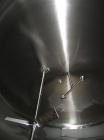 Used Cherry Burrell 8000 Gallon Vertical Stainless Steel Tank.Top mounted agitator, dual impeller, bearing block, side manway, sightglass, 3