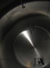 Used-Cherry Burrell 8,000 Gallon Horizontal Stainless Steel Tank.  End mount agitator approximately 5 hp.  Manway with cover...