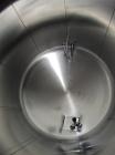 Used-Cherry Burrell 8,000 Gallon Horizontal Stainless Steel Tank.  End mount agitator approximately 5 hp.  Manway with cover...