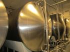 Used Cherry Burrell 8,000 Gallon Horizontal Stainless Steel Tank.  End mount agitator approximately 5 hp.  Manway with cover, sight glass, 8 legs.  Approximately 10' diameter x 12' straight side, 17'...