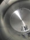Used Cherry Burrell 8,000 Gallon Horizontal Stainless Steel Tank.  End mount agitator approximately 5 hp.  Manway with cover, sight glass, 8 legs.  Approximately 10' diameter x 12' straight side, 17'...