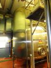 Used 8000 Gallon Stainless Steel Cherry Burrell Top Agitated Mix Tank. 