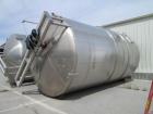 Used- Cherry Burell 15,000 Gallon, Vertical, All Stainless Steel Tank. Has top mounted agitator, flat bottom, dish top (dent...