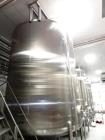 Used Cherry Burrell 6,000 Gallon Top Agitated Tank. Top mounted agitator vertical single wall stainless steel tank. 9'-6