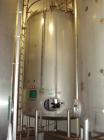 Used Mueller 6000 Gallon Stainless Steel Mix Tank. Model F 6000. Approx. 9' Diameter x 12' Straight Side. Dished Heads. Side 16