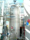 USED: Chicago Boiler tank, 6000 gallon, 316 stainless steel, vertical. Approximately 96