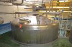 Used- Crepaco 6,000 Gallon (Approximately) Stainless Steel Vertical Single Wall Tank. Dome top, dished bottom center. Bridge...