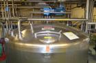 Used Crepaco 6,000 Gallon (Approximately) Vertical Stainless Steel Single Wall Tank. Dome top, dished bottom center. Bridge mounted agitator. 10 hp motor. Sweep agitator. Internal baffles. Spray ball...