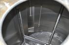 Used Crepaco 6,000 Gallon (Approximately) Vertical Stainless Steel Single Wall Tank. Dome top, dished bottom center. Bridge mounted agitator. 10 hp motor. Sweep agitator. Internal baffles. Spray ball...