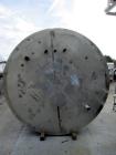 Used 6,000 Gallon Stainless Steel Storage Tank. Approximately 98'' diameter x 16' straight wall, side manhole. Inlets 2 - 3'' threaded 2 - 1.5'' threaded. Outlets 3'' threaded.