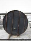 Used 6,000 Gallon Stainless Steel Storage Tank. Approximately 98'' diameter x 16' straight wall, side manhole. Inlets 2 - 3'' threaded 2 - 1.5'' threaded. Outlets 3'' threaded.