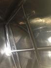 Used Crepaco 6000 Gallon Jacketed Tank with Scrape Agitation. Stainless steel cone bottom tank. Sweep scrape agitated, driven by a 5 HP Motor.  Jacket rated 158 PSI at 100 degrees F. Approximate ship...