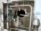 Used Crepaco Tank, 9000 Gallon, 304 Stainless Steel, Vertical. Dished top, flat bottom. Jacketed on side bottom. Side bottom mounted prop style agitator, side bottom man way. Insulated with carbon st...