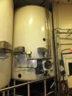 Used 10,000 DCI Gallon Mixing Tank with Vent on Top. Dish top and bottom electrically heated (previously used for liquid sugar). Bottom side manway, bottom side agitator 6.25hp Reuland motor. 11'-6