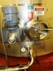 Used- 10,000 Gallon Vertical, Stainless Steel. Domed top, sloped bottom mixing tank with vent on top, bottom side manway. Bo...