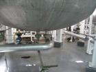 Used Enerfab Inc Vertical Tank, Approximately 7000 Gallons, Stainless Steel. Approximately 12 foot diameter x 6 foot straight side.  Dished heads. Internal rated 125 PSI at 100 Degrees F.  4 Steel le...