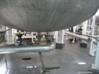 Used Enerfab Inc Vertical Tank. Approximately 7000 gallons, stainless steel. Approximately 12 ft diameter x 6 ft straight side.  Dished heads . Internal rated 125 psi @ 100 deg F.  4  Steel leg mount...