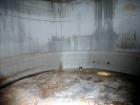 Used Evans & Sons Tank, 9000 Gallon, 316 Stainless Steel, Vertical. Approximate 126” diameter x 168” straight side, flat top and bottom. Internal atmospheric at 150 degrees F. Openings top (2) 2”, (3...
