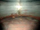 Used Evans & Sons Tank, 9000 Gallon, 316 Stainless Steel, Vertical. Approximate 126” diameter x 168” straight side, flat top and bottom. Internal atmospheric at 150 degrees F. Openings top 2”, (4) 4”...