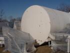 USED: 8,500 gallon Heil insulated horizontal storage tank. 304stainless steel interior, mild steel painted exterior, verticalagitator, 9'9
