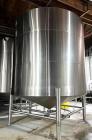 Used JV Northwest 10,000 Gallon Stainless Steel Tank with cone bottom. Vessel measures 12' diameter x 11-1/2 straight side with cone bottom leading to 4