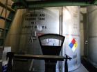Used Krenz Approximately 10,000 Gallon Stainless Steel Storage Tank. Approximately 12' diameter x 12' straight side. Flat bottom and slight cone top. Various top openings including a 17
