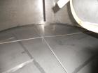 Used Krenz Approximately 10,000 Gallon Stainless Steel Storage Tank. Approximately 12' diameter x 12' straight side. Flat bottom and slight cone top. Various top openings including a 17