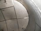 Used Krenz Approximately 10,000 Gallon Stainless Steel Storage Tank. Approximately 12' diameter x 12' straight side. Flat bottom and slight cone top. Various top openings including a 17