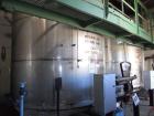 Used Krenz Approximately 10,000 Gallon Stainless Steel Storage Tank. Approximately 12' diameter x 12' straight side. Flat bottom and slight cone top. Various top openings including a 17