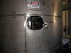 Used Krenz Approximately 10,000 Gallon Stainless Steel Storage Tank. Approximately 12' diameter x 12' straight side. Flat bottom and slight cone top. Various top openings including a 17