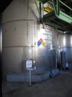 Used Krenz Approximately 10,000 Gallon Stainless Steel Storage Tank. Approximately 12' diameter x 12' straight side. Flat bottom and slight cone top. Various top openings including a 17