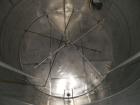 Used Krenz Approximately 10,000 Gallon Stainless Steel Storage Tank. Approximately 12' diameter x 12' straight side. Flat bottom and slight cone top. Various top openings including a 17