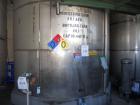 Used Krenz Approximately 10,000 Gallon Stainless Steel Storage Tank. Approximately 12' diameter x 12' straight side. Flat bottom and slight cone top. Various top openings including a 17