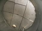 Used Krenz approx. 10,000 gallon stainless steel storage tank. Approx. 12' diameter x 12' straight side. Flat bottom and slight cone top. Various top openings including a 17