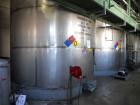 Used Krenz approx. 10,000 gallon stainless steel storage tank. Approx. 12' diameter x 12' straight side. Flat bottom and slight cone top. Various top openings including a 17