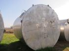 Used Krenz Approximately 8,500 Gallon Stainless Steel Storage Tank. Approximately 11' diameter x 12' straight side. Flat bottom and slight cone top. Various top openings including a 17