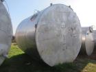 Used Krenz Approximately 8,500 Gallon Stainless Steel Storage Tank. Approximately 11' diameter x 12' straight side. Flat bottom and slight cone top. Various top openings including a 17