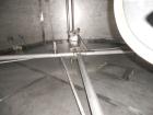 Used Krenz Approximately 8,500 Gallon Stainless Steel Storage Tank. Approximately 11' diameter x 12' straight side. Flat bottom and slight cone top. Various top openings including a 17