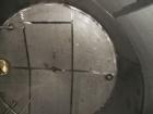Used Krenz Approximately 8,500 Gallon Stainless Steel Storage Tank. Approximately 11' diameter x 12' straight side. Flat bottom and slight cone top. Various top openings including a 17