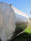 Used Krenz Approximately 8,500 Gallon Stainless Steel Storage Tank. Approximately 11' diameter x 12' straight side. Flat bottom and slight cone top. Various top openings including a 17