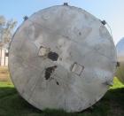 Used Krenz Approximately 8,500 Gallon Stainless Steel Storage Tank. Approximately 11' diameter x 12' straight side. Flat bottom and slight cone top. Various top openings including a 17