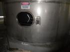 Used Krenz Approximately 8,500 Gallon Stainless Steel Storage Tank. Approximately 11' diameter x 12' straight side. Flat bottom and slight cone top. Various top openings including a 17