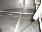 Used Krenz Approximately 8,500 Gallon Stainless Steel Storage Tank. Approximately 11' diameter x 12' straight side. Flat bottom and slight cone top. Various top openings including a 17