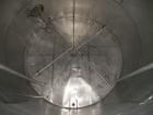 Used Krenz Approximately 8,500 Gallon Stainless Steel Storage Tank. Approximately 11' diameter x 12' straight side. Flat bottom and slight cone top. Various top openings including a 17